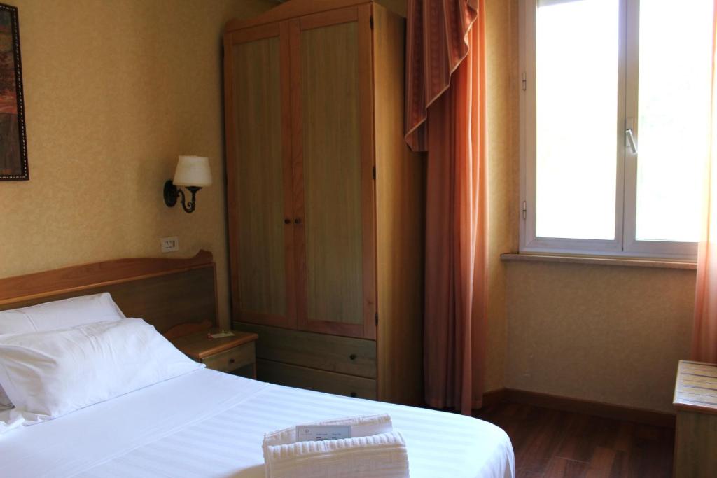 Postel nebo postele na pokoji v ubytování Phi Hotel Ambra