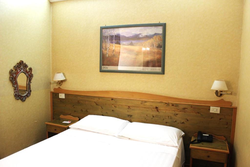 Postel nebo postele na pokoji v ubytování Phi Hotel Ambra