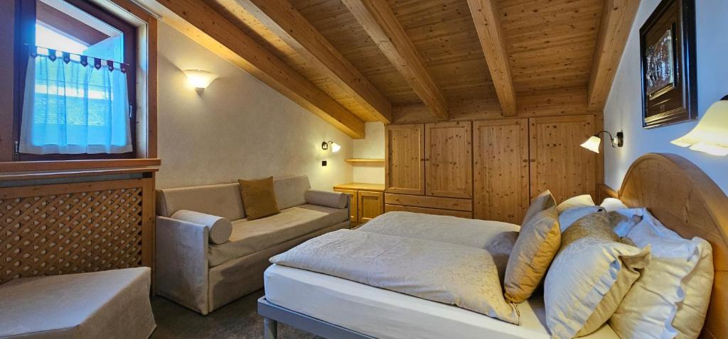 Postel nebo postele na pokoji v ubytování Albergo Alpenrose