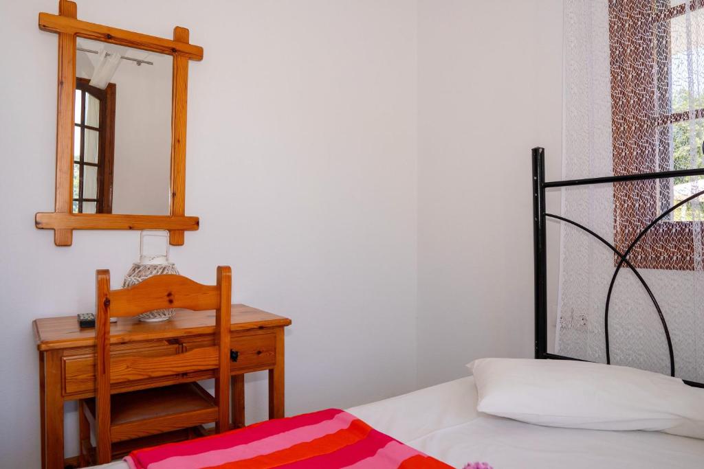 Postel nebo postele na pokoji v ubytování Paradeisos Rooms Pelion