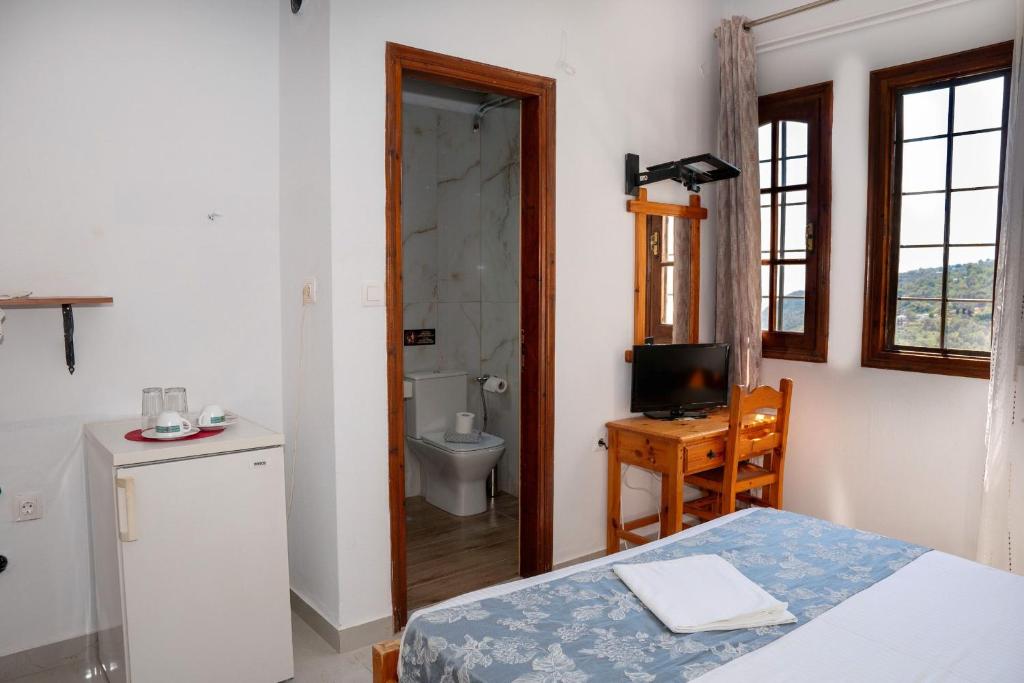 Postel nebo postele na pokoji v ubytování Paradeisos Rooms Pelion