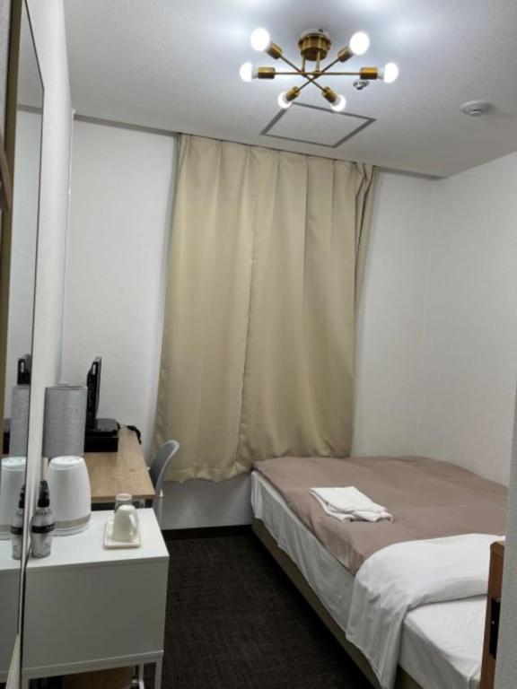 Postel nebo postele na pokoji v ubytování Hotel Royal Oak Gotanda