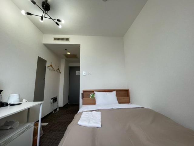 Postel nebo postele na pokoji v ubytování Hotel Royal Oak Gotanda