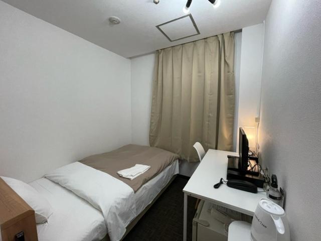 Postel nebo postele na pokoji v ubytování Hotel Royal Oak Gotanda