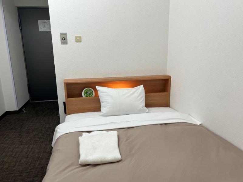 Postel nebo postele na pokoji v ubytování Hotel Royal Oak Gotanda