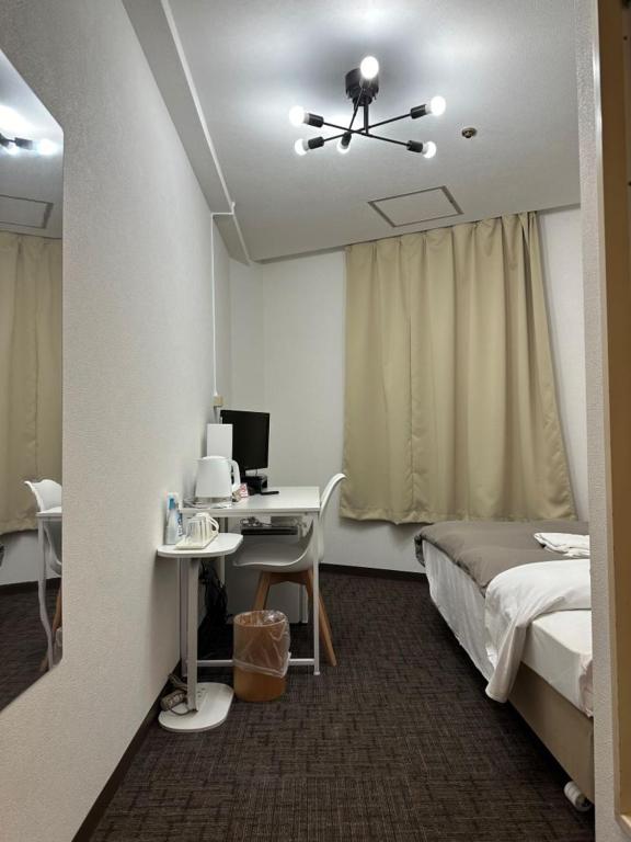 Postel nebo postele na pokoji v ubytování Hotel Royal Oak Gotanda