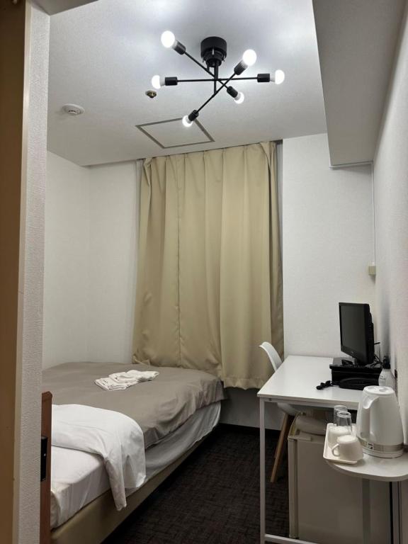 Postel nebo postele na pokoji v ubytování Hotel Royal Oak Gotanda