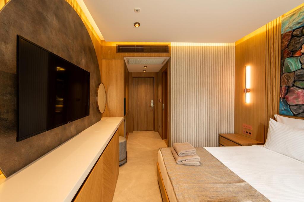 Postel nebo postele na pokoji v ubytování Casa Mimas Hotel