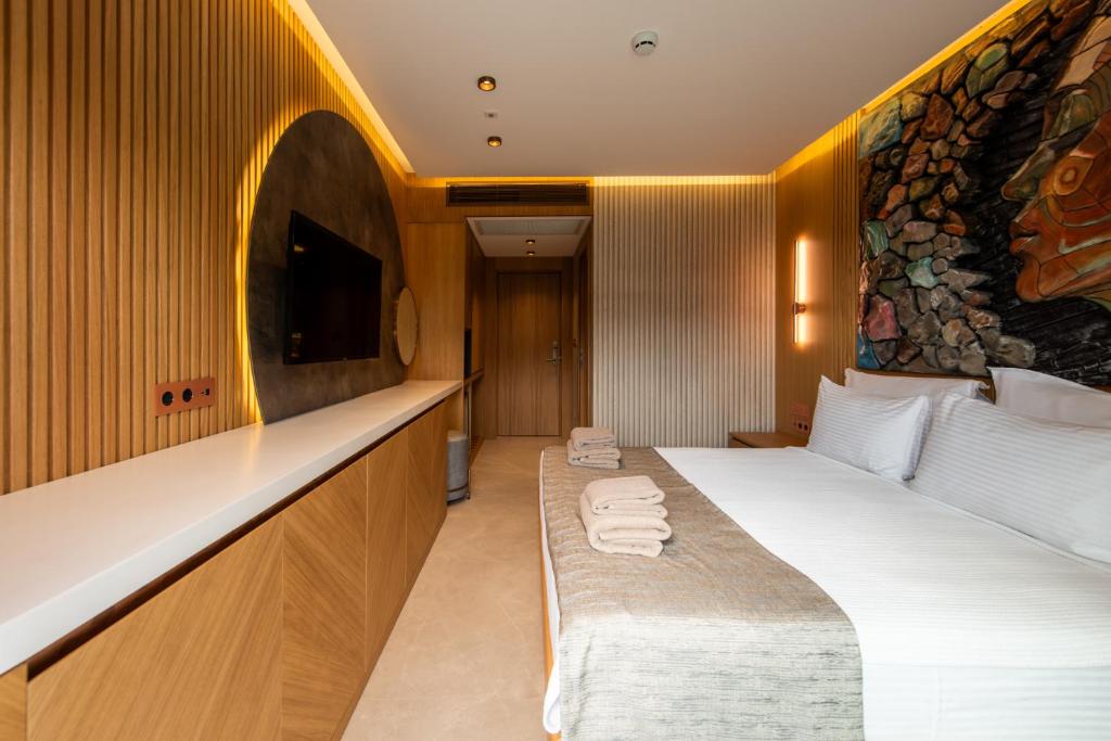 Postel nebo postele na pokoji v ubytování Casa Mimas Hotel