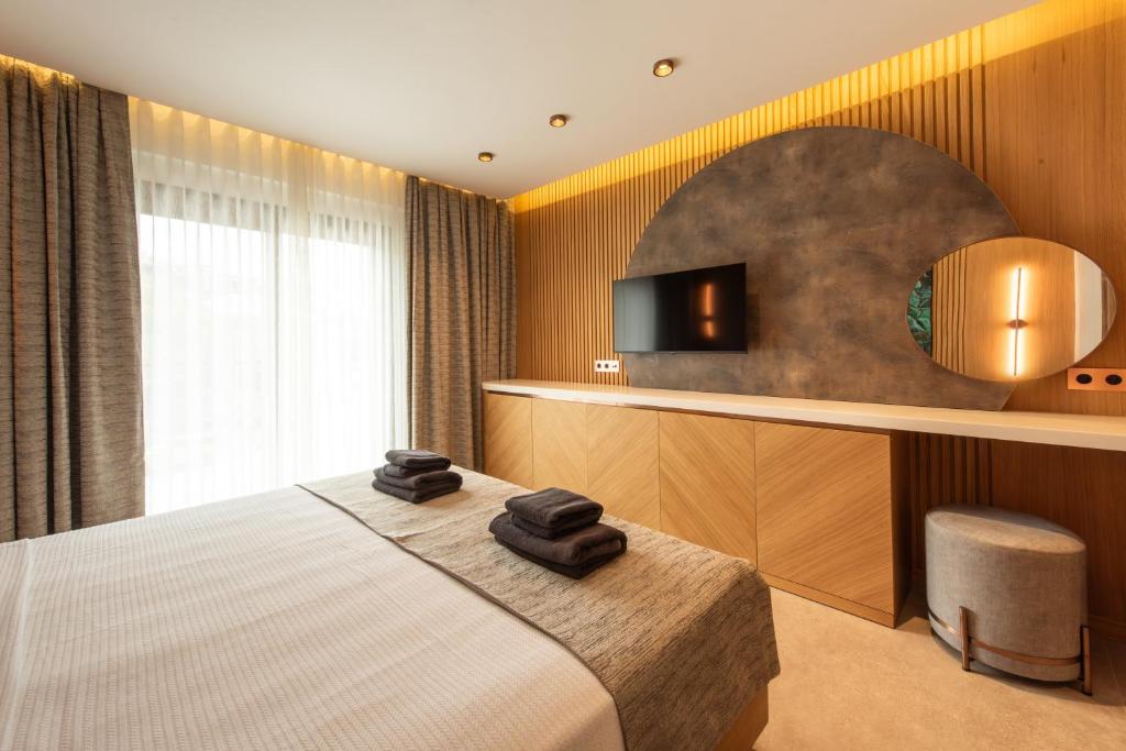 Postel nebo postele na pokoji v ubytování Casa Mimas Hotel