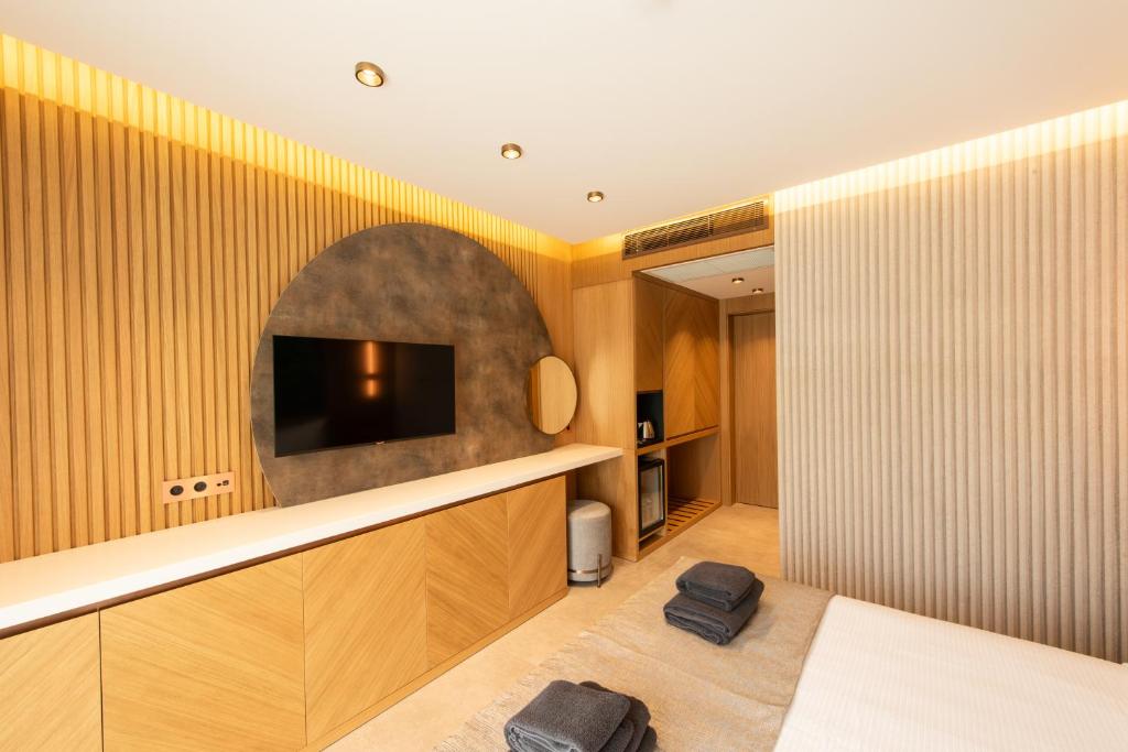 TV a/nebo společenská místnost v ubytování Casa Mimas Hotel