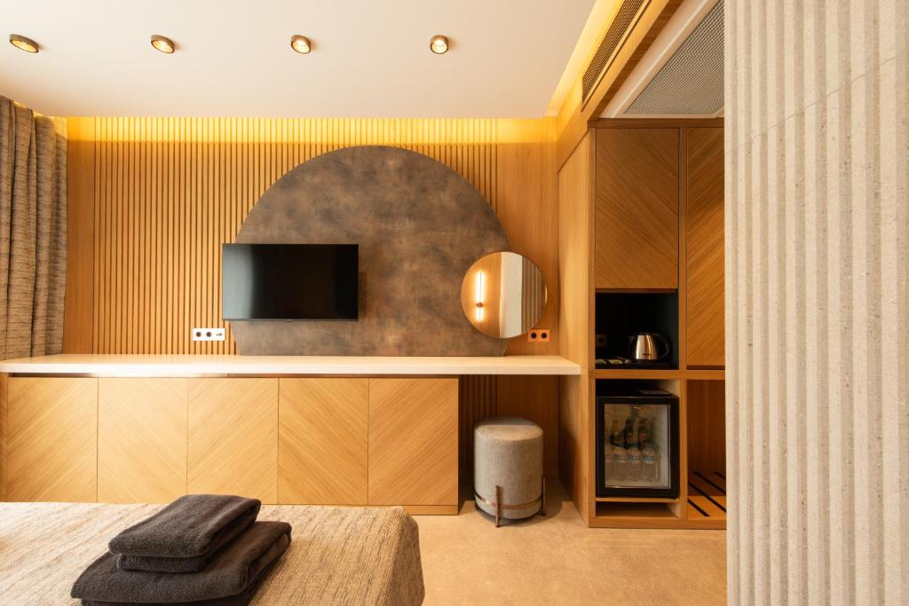 TV a/nebo společenská místnost v ubytování Casa Mimas Hotel