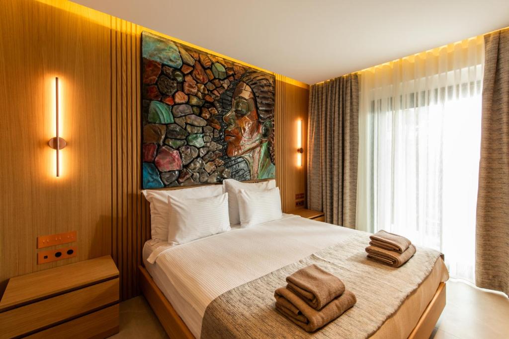 Postel nebo postele na pokoji v ubytování Casa Mimas Hotel