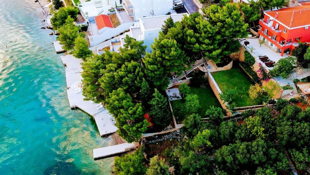 an aerial view of a house next to the water at Candela, No 3 in Starigrad-Paklenica