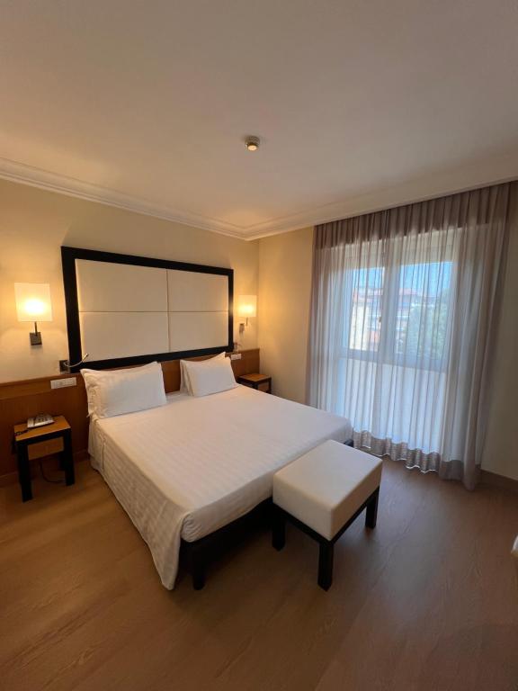 Postel nebo postele na pokoji v ubytování Hotel Daniel & Ristorante Cocchi