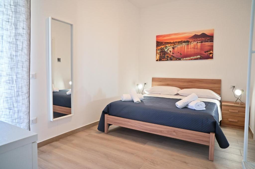 Postel nebo postele na pokoji v ubytování FRONTEMARE Suites