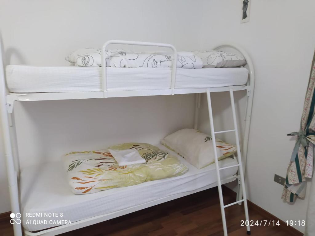 Postel nebo postele na pokoji v ubytování Casa vacanze Aielli Risorgimento