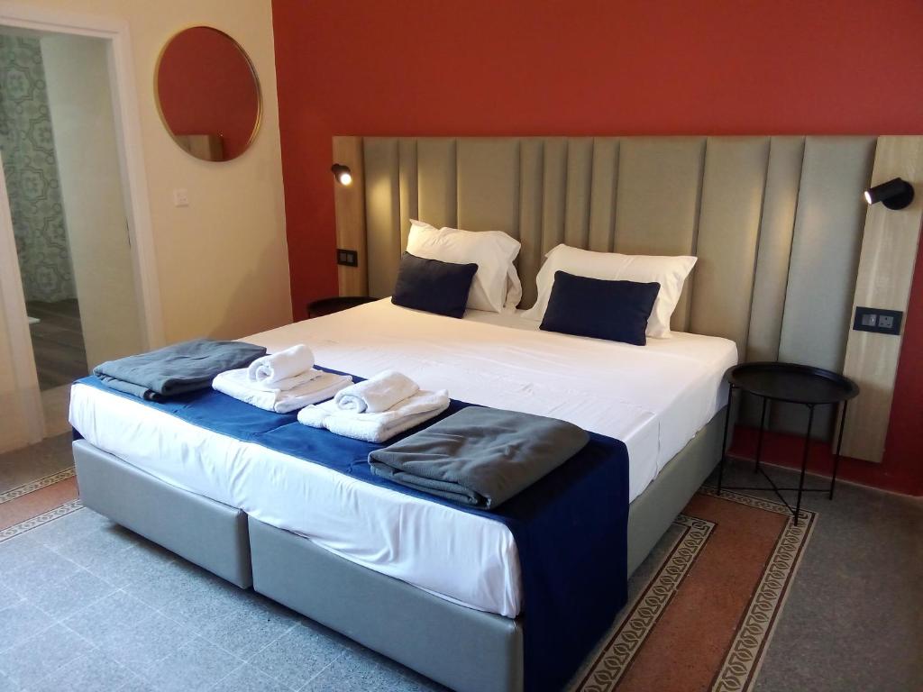 Postel nebo postele na pokoji v ubytování Mulberry Suites