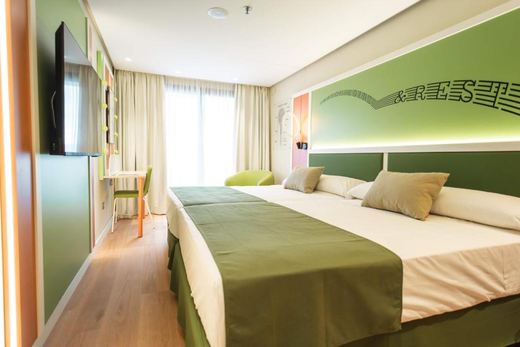 Postel nebo postele na pokoji v ubytování Hotel Magic Sports 4