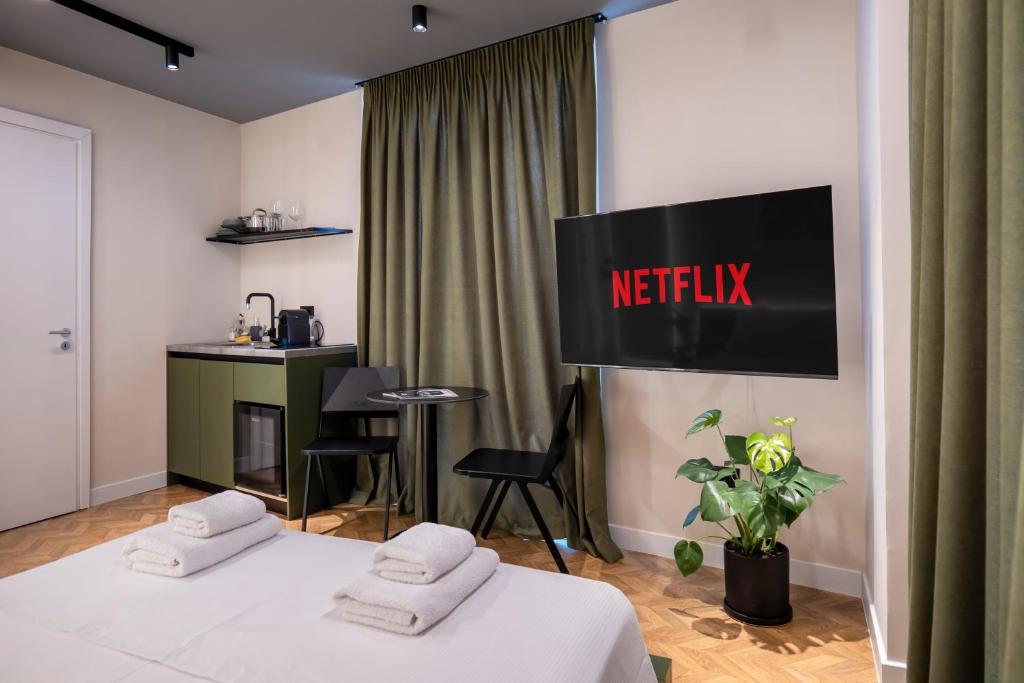 Postel nebo postele na pokoji v ubytování MUZ Studios