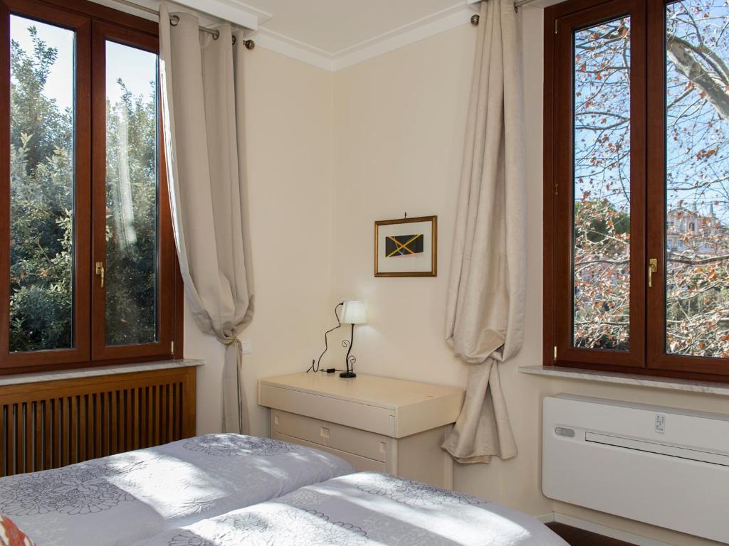 Posteľ alebo postele v izbe v ubytovaní The Apartments - Vatican