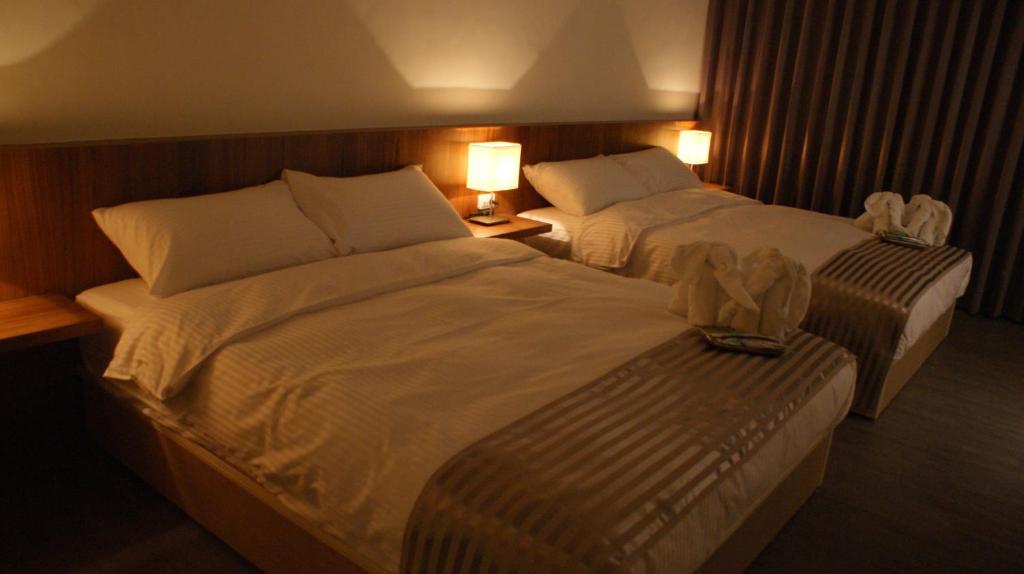 Postel nebo postele na pokoji v ubytování Bai Ji Yi B&B
