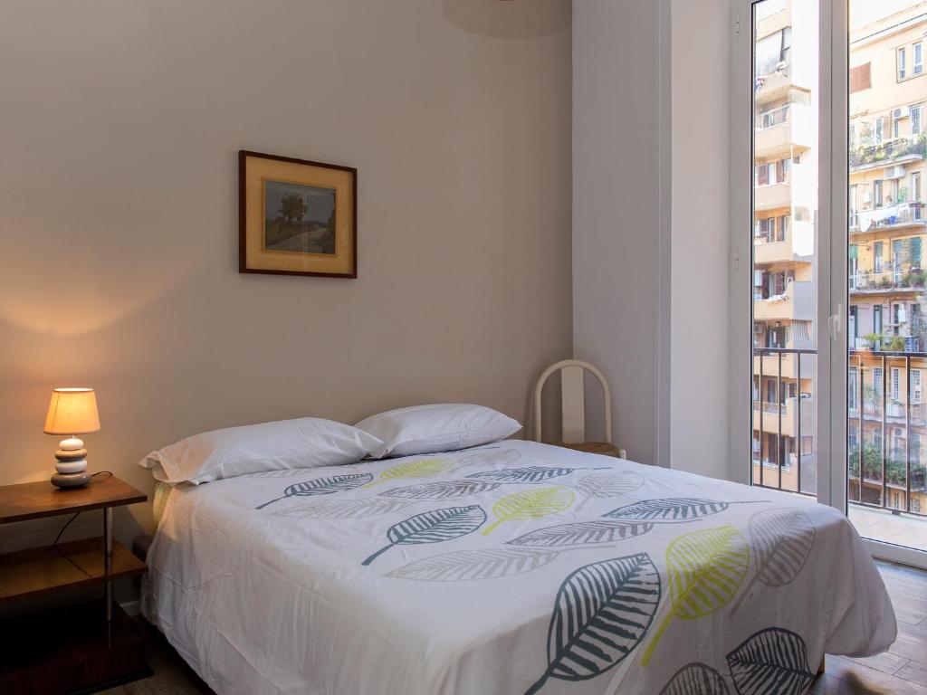 Posteľ alebo postele v izbe v ubytovaní The Apartments - Vatican
