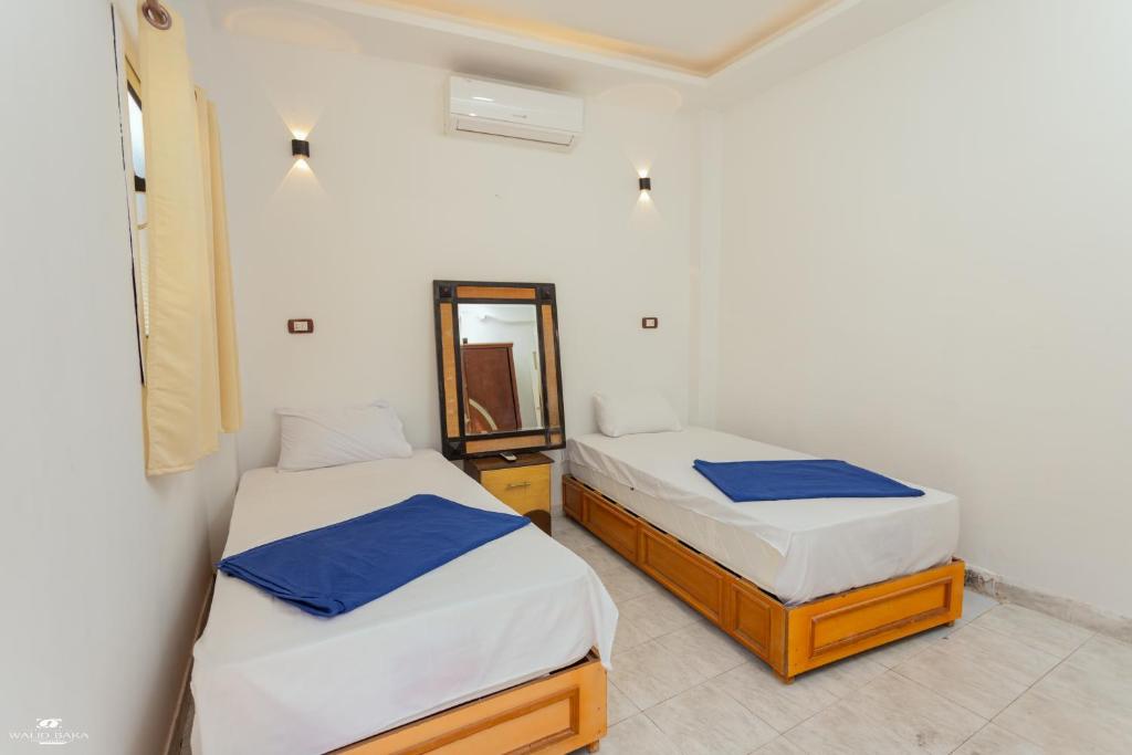Postel nebo postele na pokoji v ubytování Home Hotel Dahab