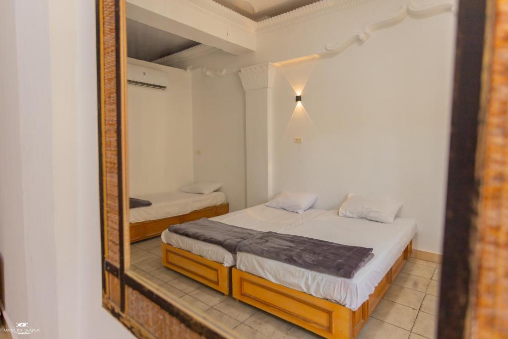 Postel nebo postele na pokoji v ubytování Home Hotel Dahab