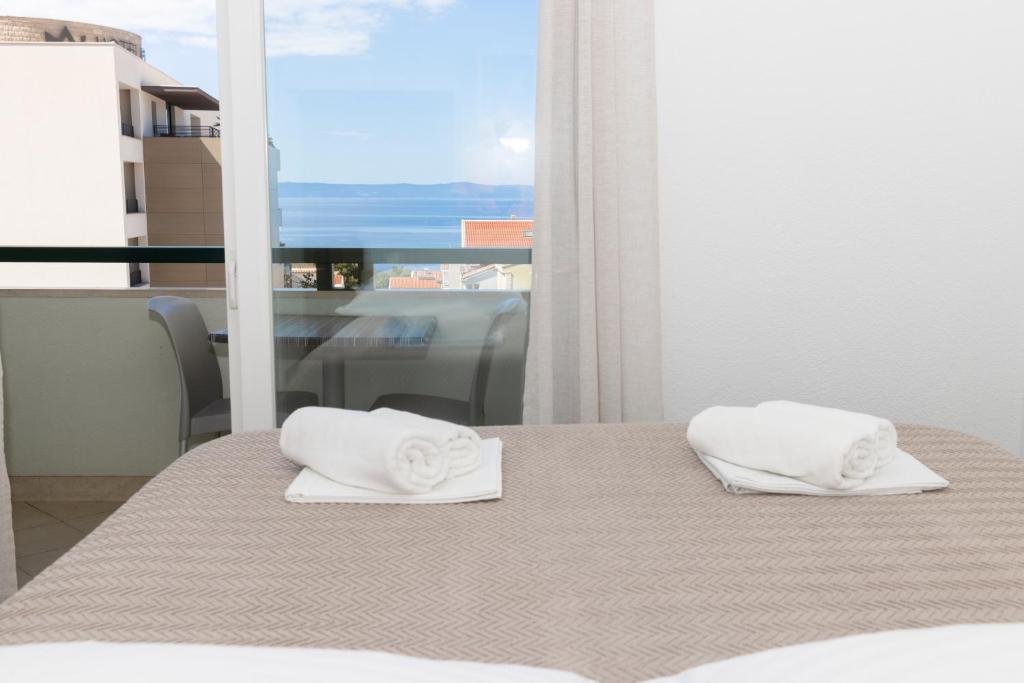 Posteľ alebo postele v izbe v ubytovaní Vidoš apartments