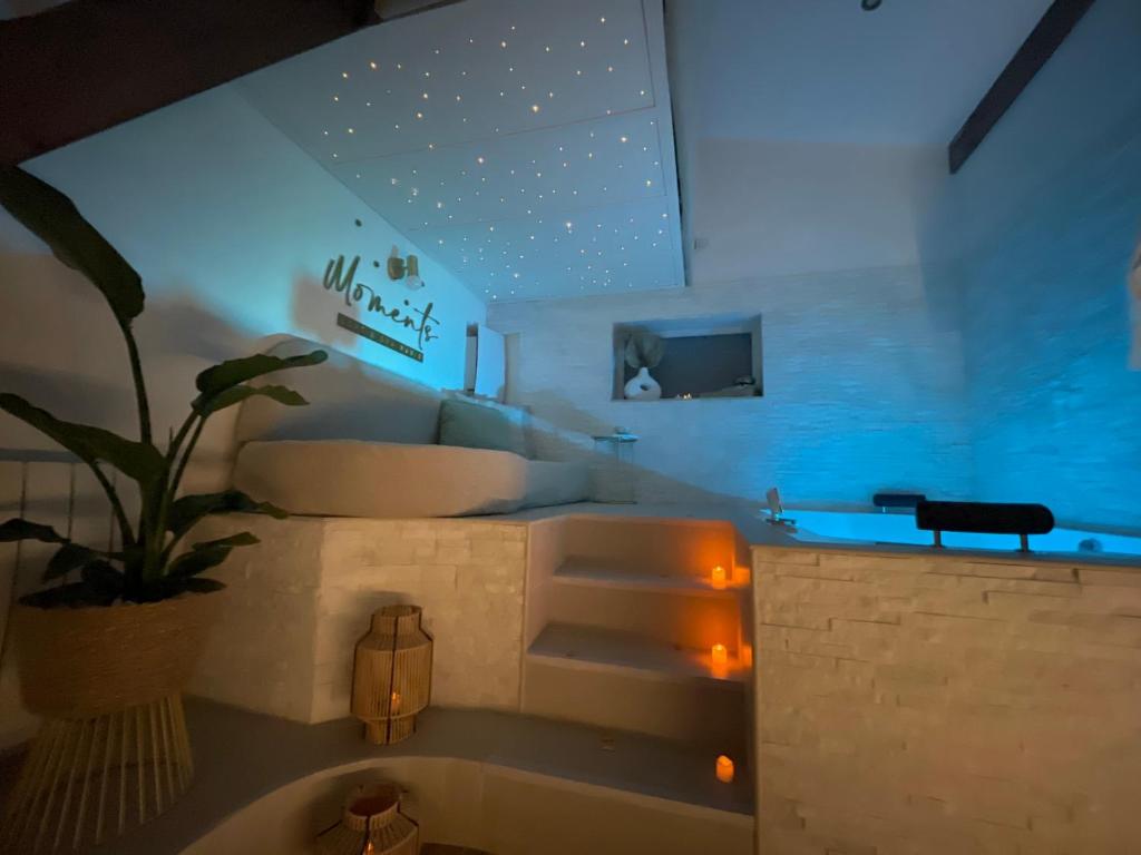 a living room with a bath tub and a couch at Moments Loft & Spa Paris in Montesson
