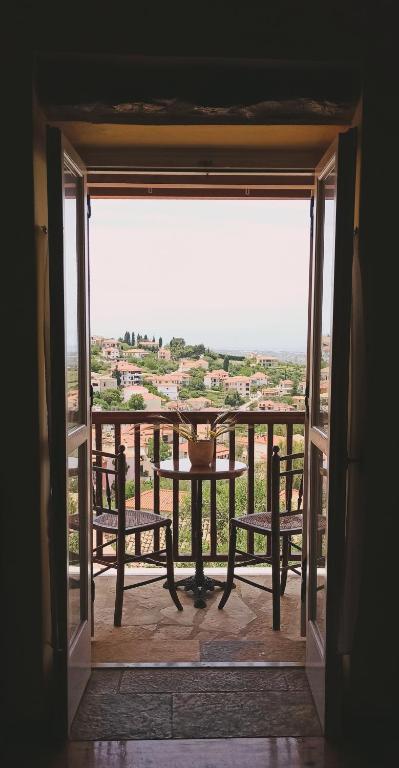 a view of a balcony with a table and chairs at Το Αρχοντικό του Κάστρου in Kyparissia