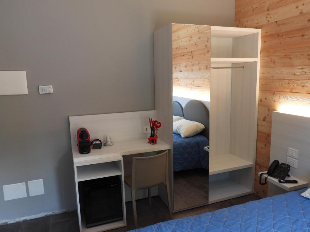 Postel nebo postele na pokoji v ubytování Albergo Rusen