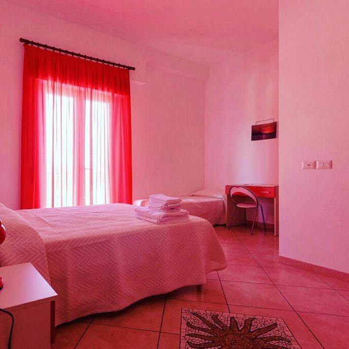 Postel nebo postele na pokoji v ubytování B&B Rose Villa
