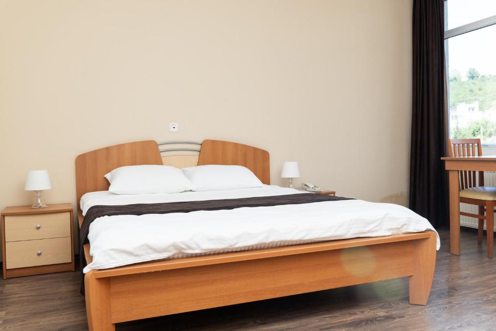 Postel nebo postele na pokoji v ubytování Hotel Luxor