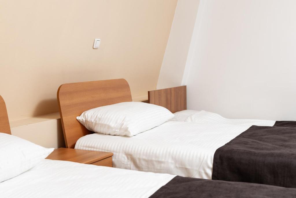 Postel nebo postele na pokoji v ubytování Hotel Luxor