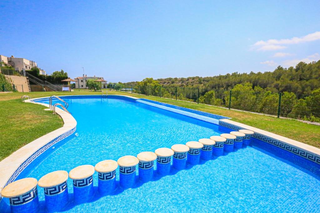 Bazén v ubytování LITORAL COSTA DORADA - LAS TERRAZAS Only families nebo v jeho okolí