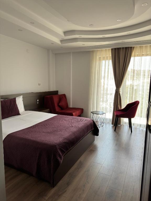 Postel nebo postele na pokoji v ubytování Hotel Real