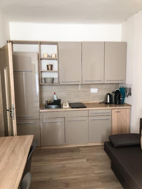 Kuchyň nebo kuchyňský kout v ubytování M&C Apartmans