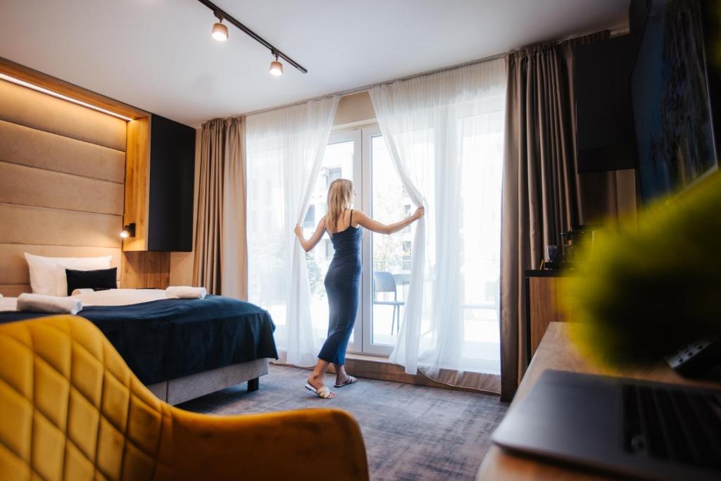 Postel nebo postele na pokoji v ubytování Hotel Auris