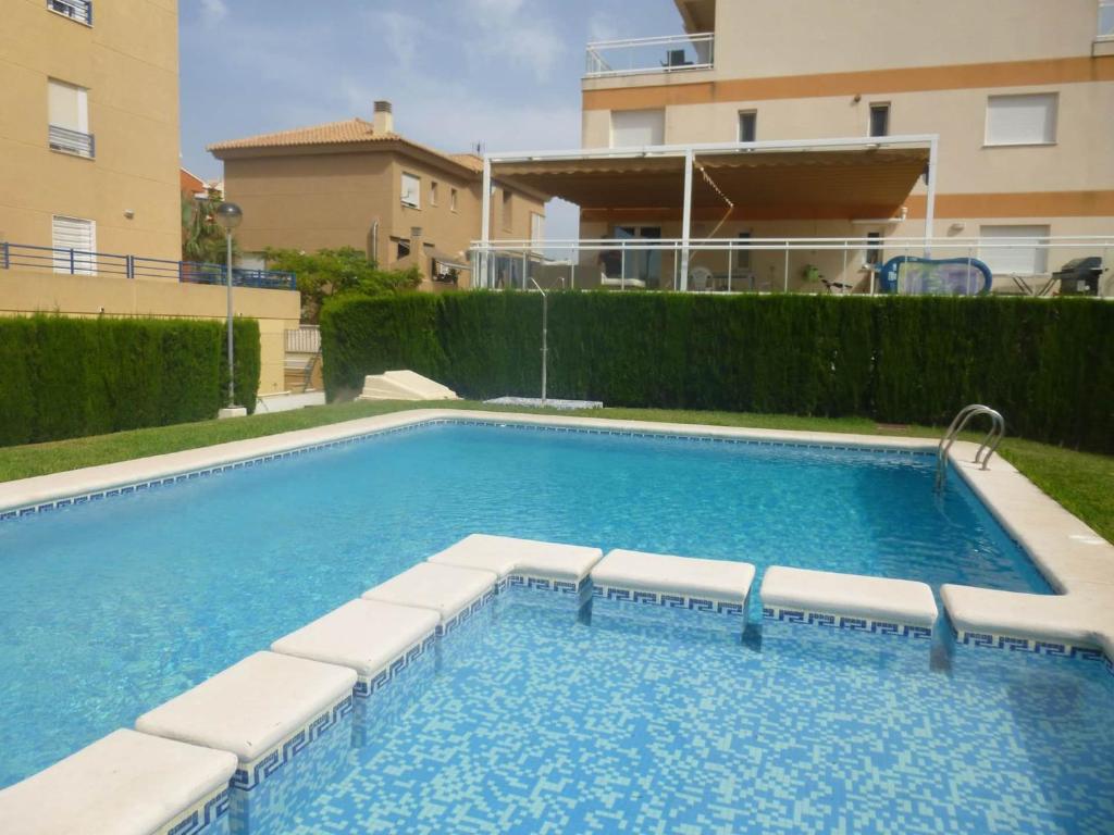 Piscina de la sau aproape de Apartamento Ozieri con piscina y vistas al mar