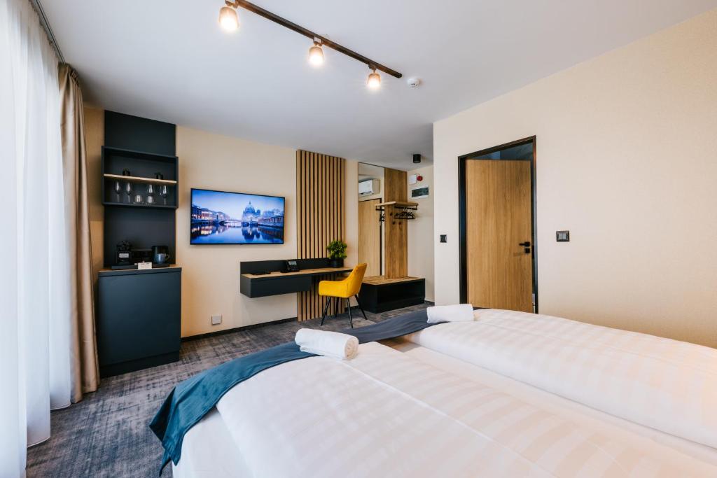 Postel nebo postele na pokoji v ubytování Hotel Auris