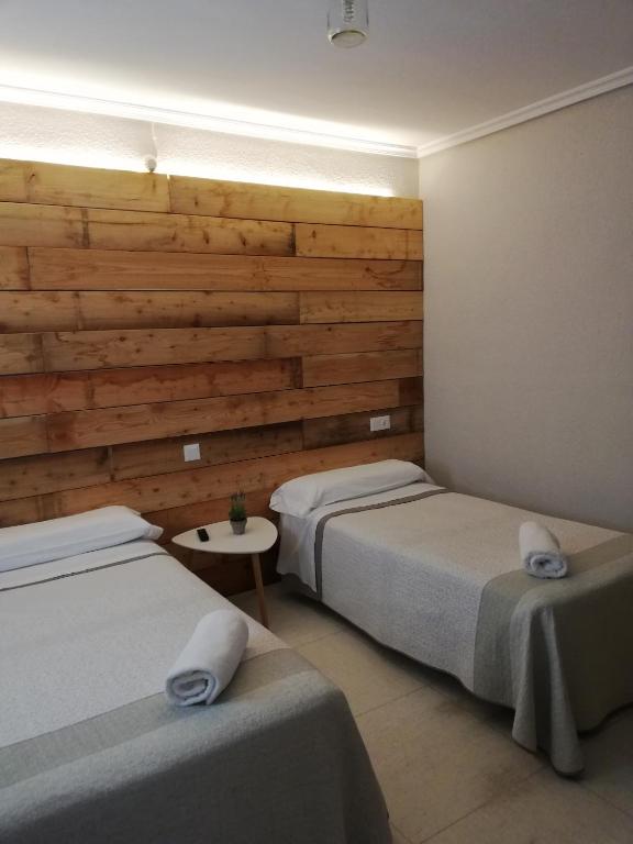 Postel nebo postele na pokoji v ubytování Hostal Ochoa