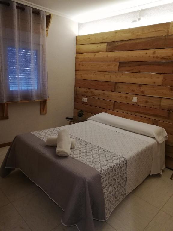 Postel nebo postele na pokoji v ubytování Hostal Ochoa