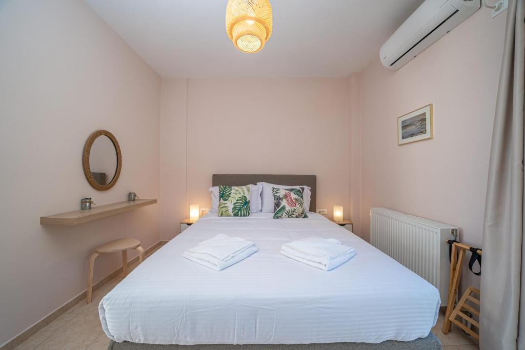 Postel nebo postele na pokoji v ubytování Tassos House Fiskardo Kefalonia