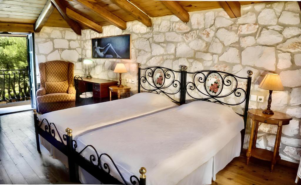 A bed or beds in a room at Aresti Mountain Resort