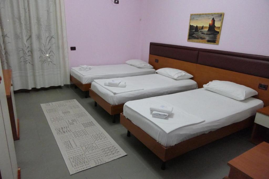 Postel nebo postele na pokoji v ubytování Hotel Edland