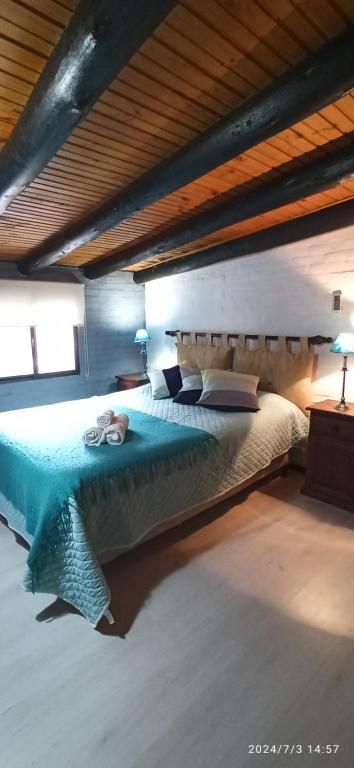 En eller flere senge i et værelse på Villa Anita Piriapolis