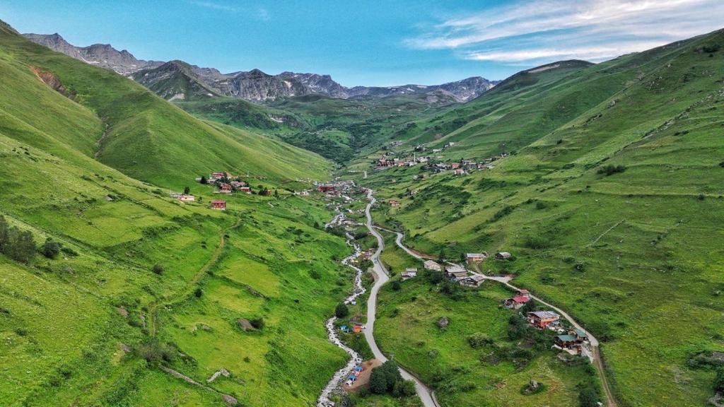 an aerial view of a mountain valley with a river at Zirve Apart in Uzungöl