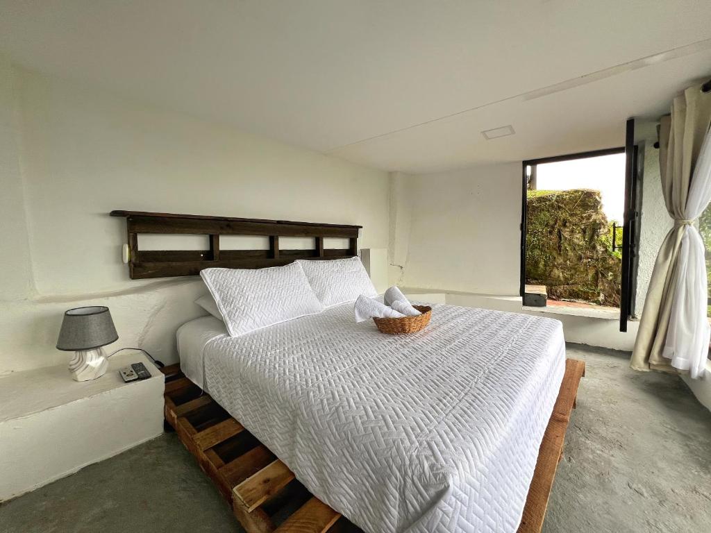 Cama o camas de una habitación en Hospedaje Mirador La Aurora Filandia